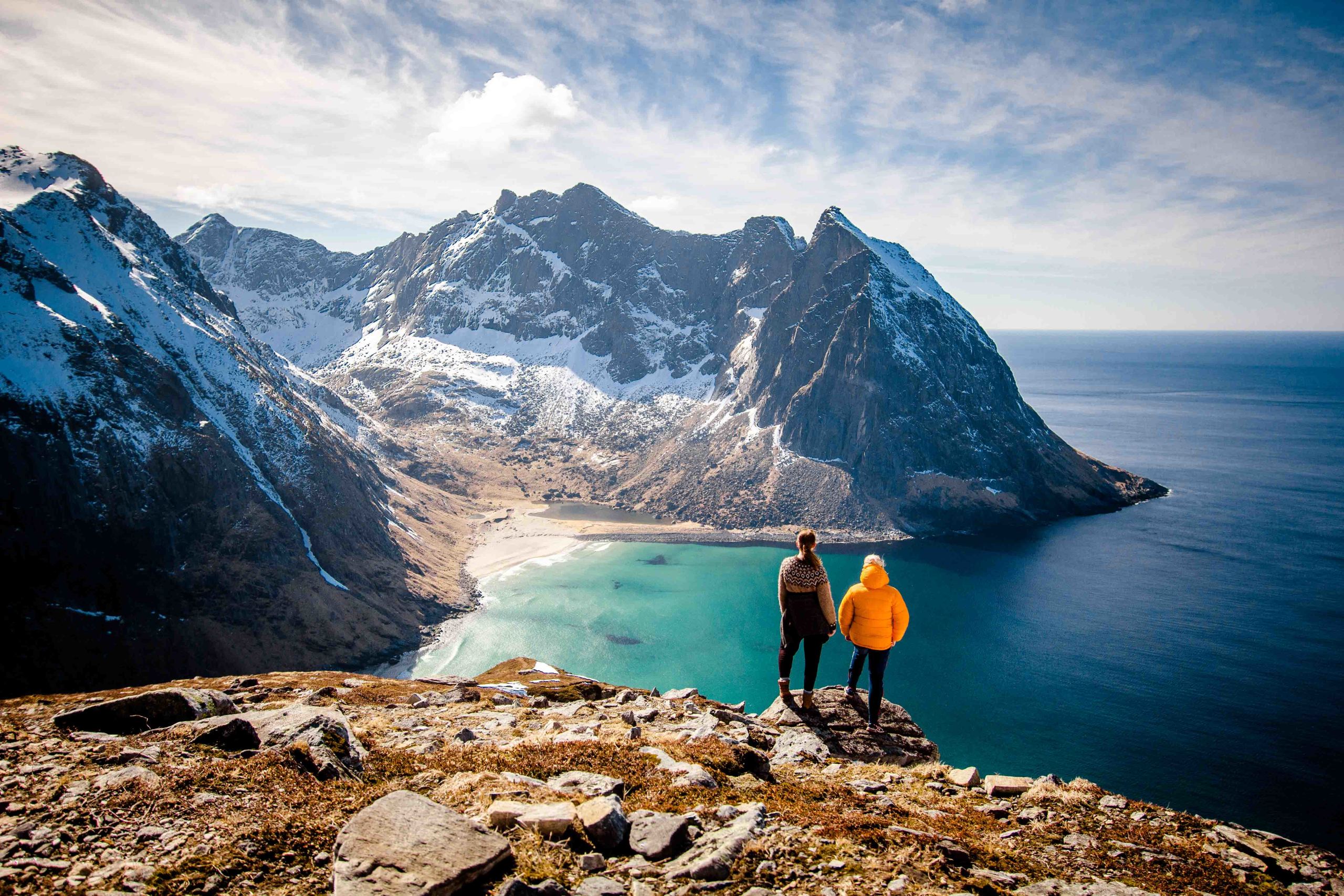 Guide showing a secret place to a guest on the Lofoten Islands